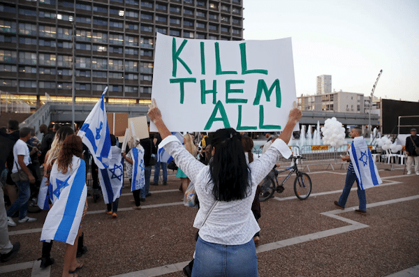 | A supporter of Elor Azaria an Israeli soldier charged with manslaughter after he shot a wounded Palestinian as he lay on the ground in Hebron holds a placard during a protest calling for his release in Tel Aviv on April 19 © Baz Ratner ReutersREUTERS | MR Online